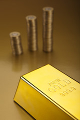 Gold bar and coins
