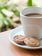 coffee cup with cookie .