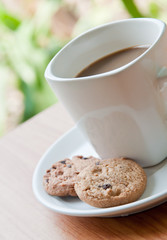 coffee cup with cookie .