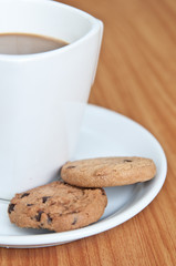 coffee cup with cookie .