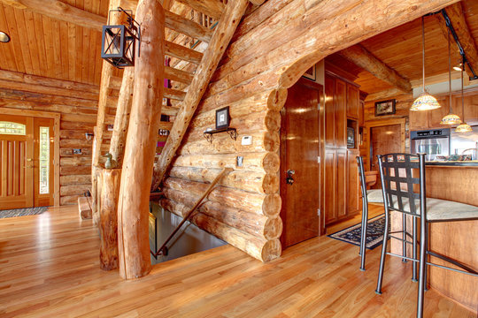 Log cabin kitchen and staircase interior.