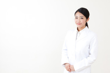 a portrait of asian woman wearing lab coat