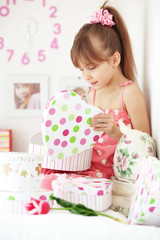 Kid girl with gift boxes