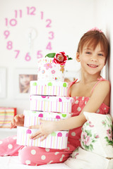 Kid girl with gift boxes