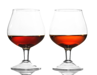Two glasses of cognac isolated on white