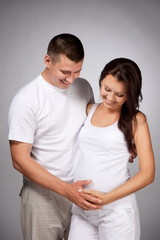 Portrait of young pair pending the kid