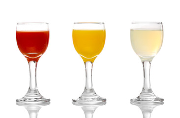 Tropical juices in glasses isolated on white