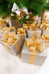 Fototapeta na wymiar Boxes of presents under the Christmas tree