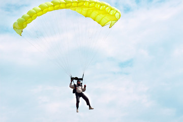 parachutist in the blue sky
