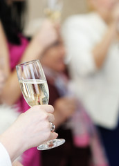 Woman holding glass with champagne