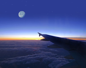 evening sky with wing of plane