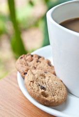 coffee cup with cookie .