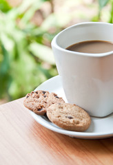 coffee cup with cookie .