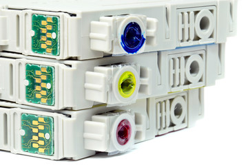 Close up of used coloured ink printer cartridges with chips