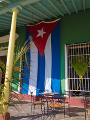 Cuban flag in an old house in the town of Trinidad in Cuba