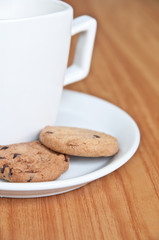 coffee cup with cookie .