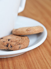 coffee cup with cookie .