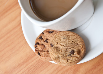 coffee cup with cookie .