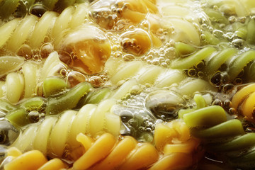 spiral pasta in boiling hot water