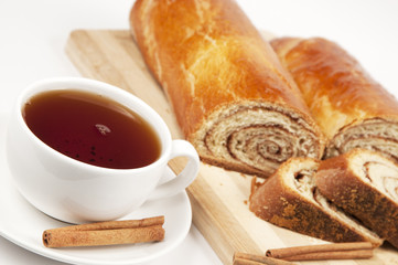 Tea and home sweet rolls with cinnamon