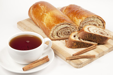 Tea and home sweet rolls with cinnamon