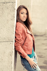 Happy young girl in red jacket