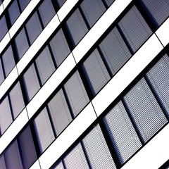 Abstract angle of glass and metal windows of a tower block