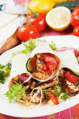 Grilled chicken and salad in tortilla wrap