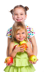 Fototapeta na wymiar Portrait of two happy girls with apple