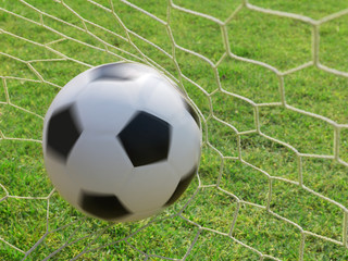 Fototapeta na wymiar Football spinning in goal