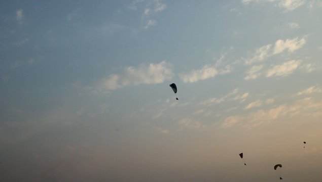 paraglider activity fly with beautiful sunset background