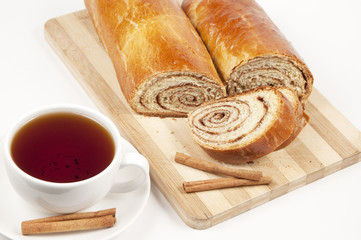 Tea and home sweet rolls with cinnamon
