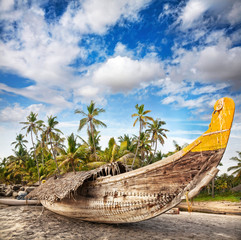 Fisherman boat on the beach - obrazy, fototapety, plakaty