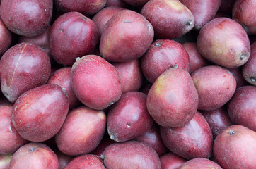 Ripe red pears on display