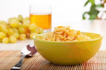 Breakfast with corn flakes close-up