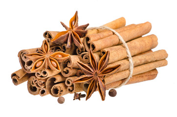 Cinnamon and anise on isolated white background