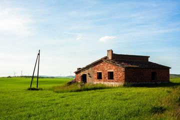 Fototapeta na wymiar Abandoned House on a Meadow in Apulia, Italy