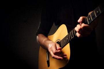 Man playing acoustic guitar