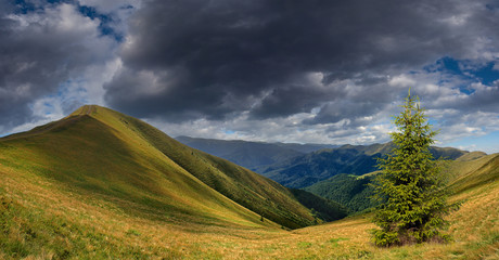 Summer landscape in the mountains with storm clouds