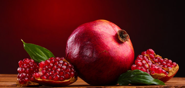 ripe pomegranate fruit with leaves