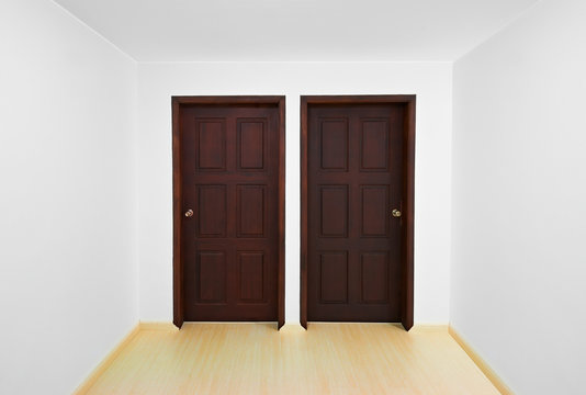 Decision time concept: Room with two doors, each one is a differ