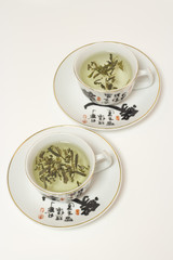 Two tea cup in a white table