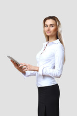 Young beautiful woman in business wear at work