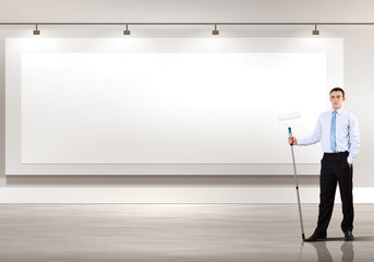 Young businesswoman with a paint brush