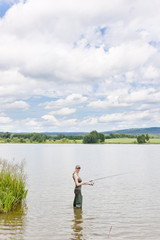 woman fishing in pond