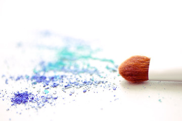 blue eyeshadow make-up powder and brush with shallow dof
