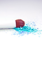 blue eyeshadow make-up powder and brush with shallow dof