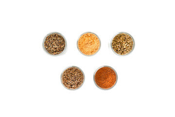 Spices and herbs in small glass bowls