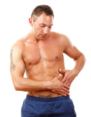 Fototapeta premium A muscular man having pain in the small of his back