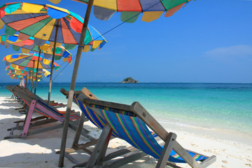 Beach chair and colorful umbrella on the beach , Phuket Thailand
